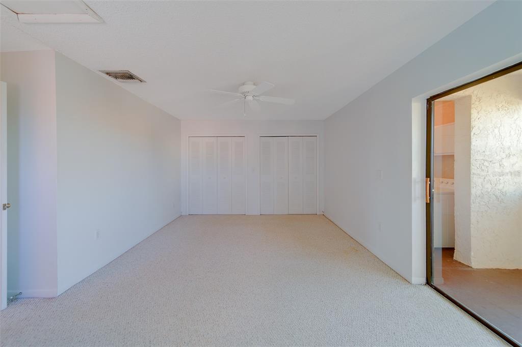 1 Windrush Boulevard, Unit 28 Indian Rocks Beach, FL 33785 - Photo 16 of 68 an empty room with a empty space and a window