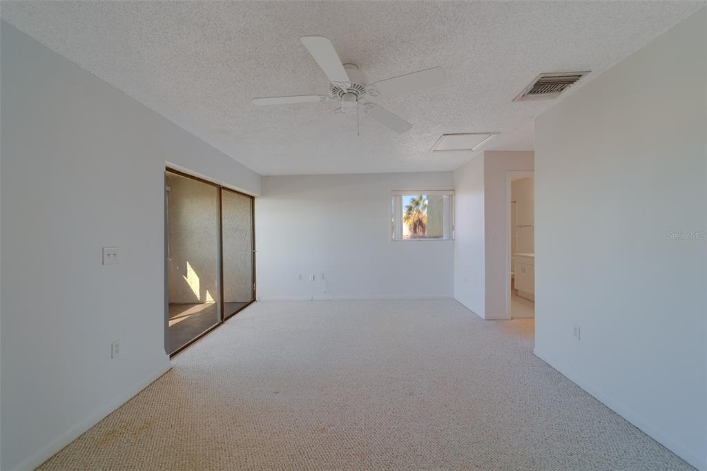 1 Windrush Boulevard, Unit 28 Indian Rocks Beach, FL 33785 - Photo 18 of 68 a view of an empty room and a window