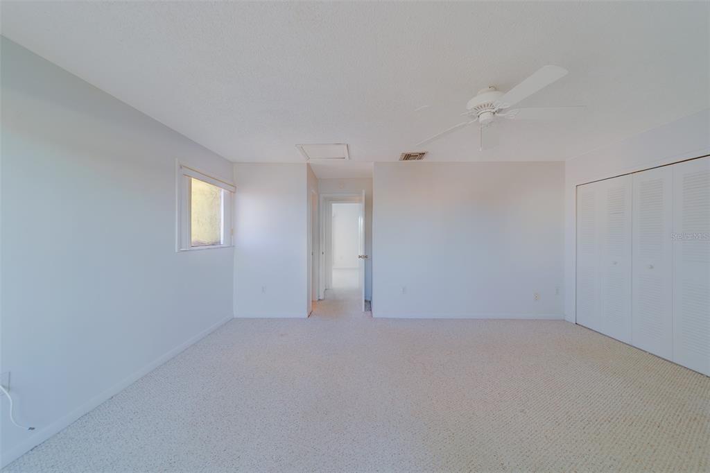 1 Windrush Boulevard, Unit 28 Indian Rocks Beach, FL 33785 - Photo 19 of 68 a view of an empty room with a window
