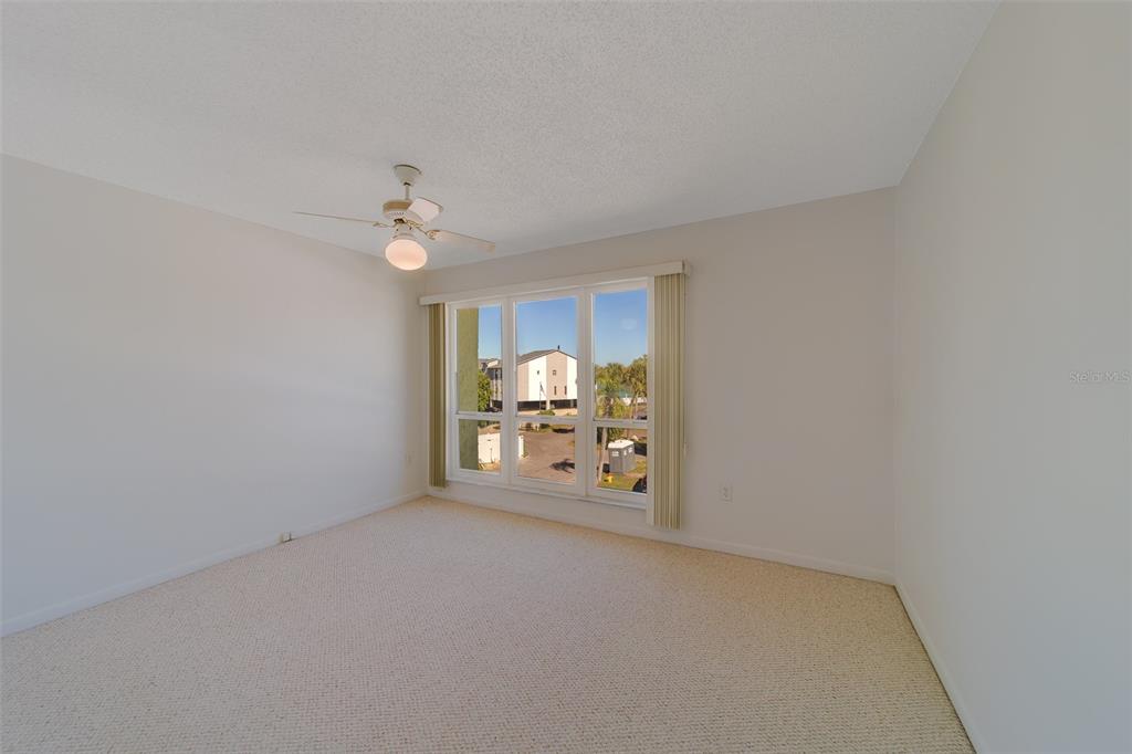 1 Windrush Boulevard, Unit 28 Indian Rocks Beach, FL 33785 - Photo 22 of 68 a view of a livingroom with a cabinet and couch