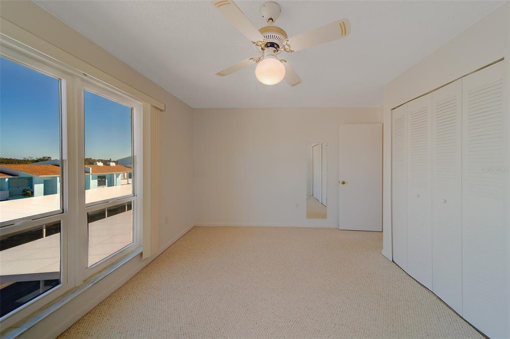 1 Windrush Boulevard, Unit 28 Indian Rocks Beach, FL 33785 - Photo 24 of 68 a view of an empty room with a window
