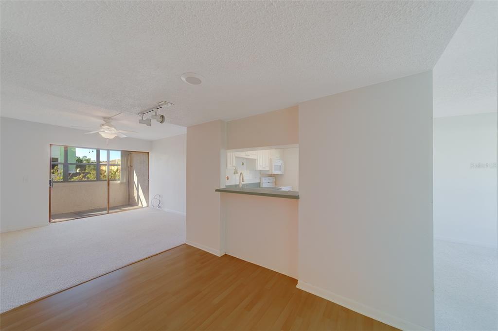 1 Windrush Boulevard, Unit 28 Indian Rocks Beach, FL 33785 - Photo 3 of 68 an empty room with windows and entrance