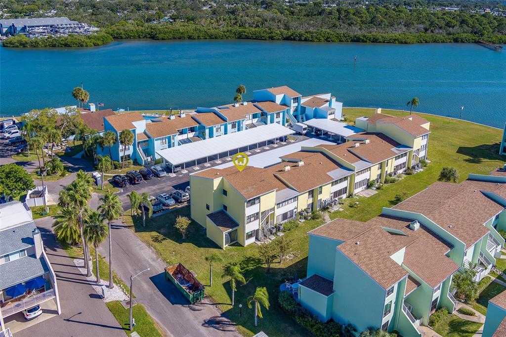 1 Windrush Boulevard, Unit 28 Indian Rocks Beach, FL 33785 - Photo 45 of 68 an aerial view of a house with a lake view