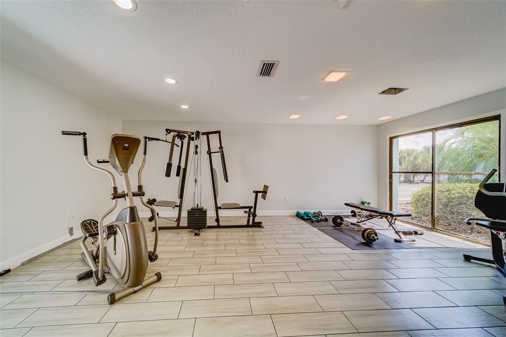 1 Windrush Boulevard, Unit 28 Indian Rocks Beach, FL 33785 - Photo 51 of 68 a view of a room with gym equipment