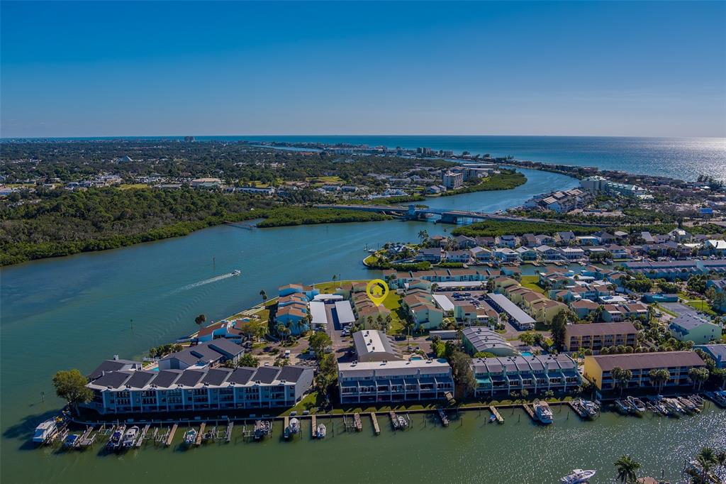 1 Windrush Boulevard, Unit 28 Indian Rocks Beach, FL 33785 - Photo 65 of 68 an aerial view of a chairs and table on the terrace