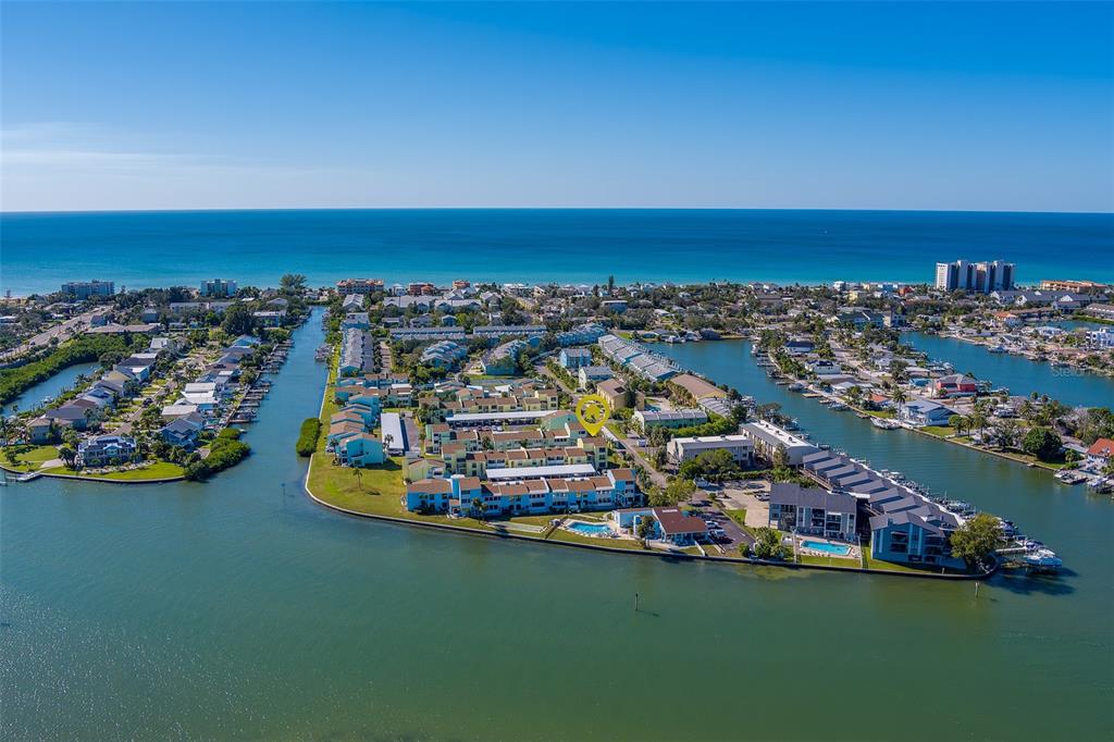 1 Windrush Boulevard, Unit 28 Indian Rocks Beach, FL 33785 - Photo 68 of 68 an aerial view of a house with a ocean view