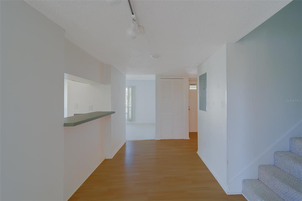 1 Windrush Boulevard, Unit 28 Indian Rocks Beach, FL 33785 - Photo 7 of 68 a view of a hallway with wooden floor