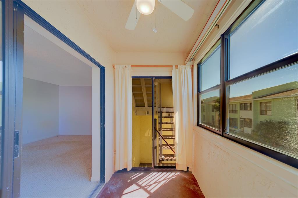 1 Windrush Boulevard, Unit 28 Indian Rocks Beach, FL 33785 - Photo 9 of 68 a view of bedroom with a large window