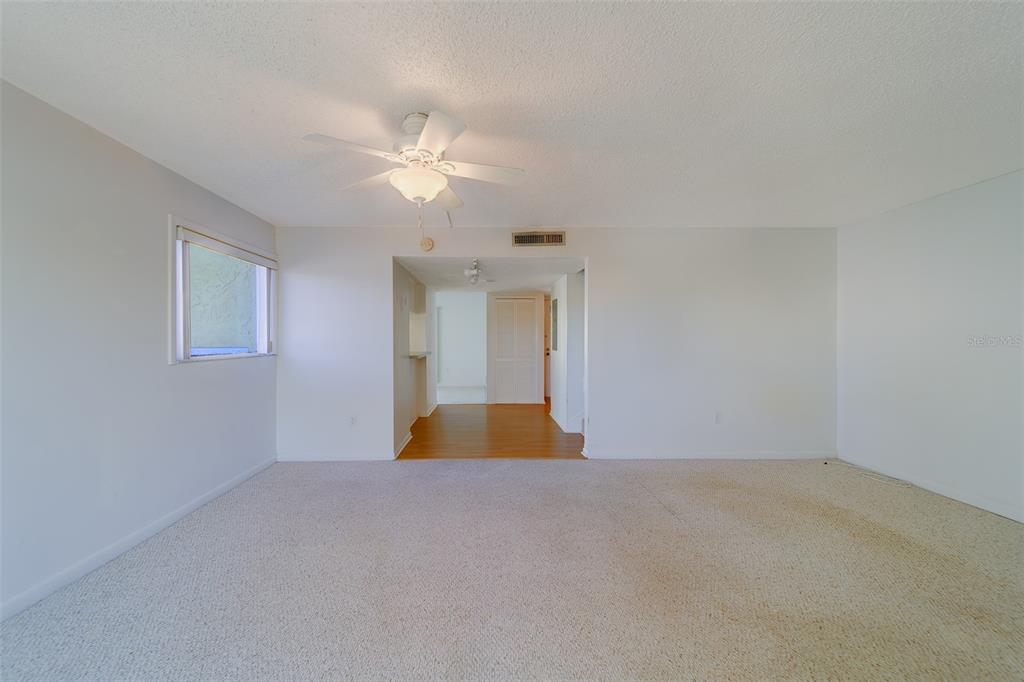 1 Windrush Boulevard, Unit 28 Indian Rocks Beach, FL 33785 - Photo 10 of 68 a view of an empty room with a window
