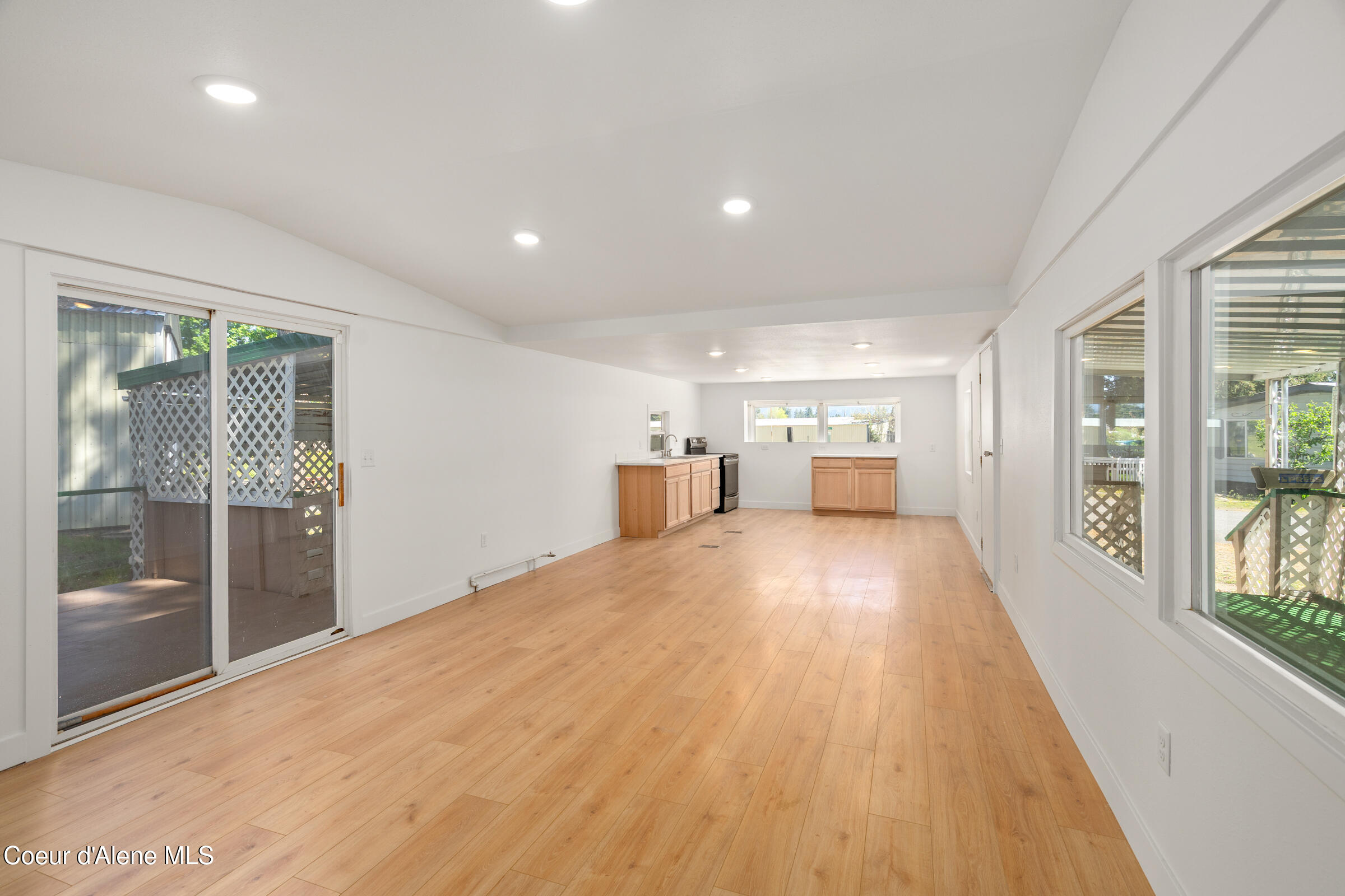 8603 North Hayden Pines Way Hayden, ID 83835 - Photo 2 of 18 living room to kitchen