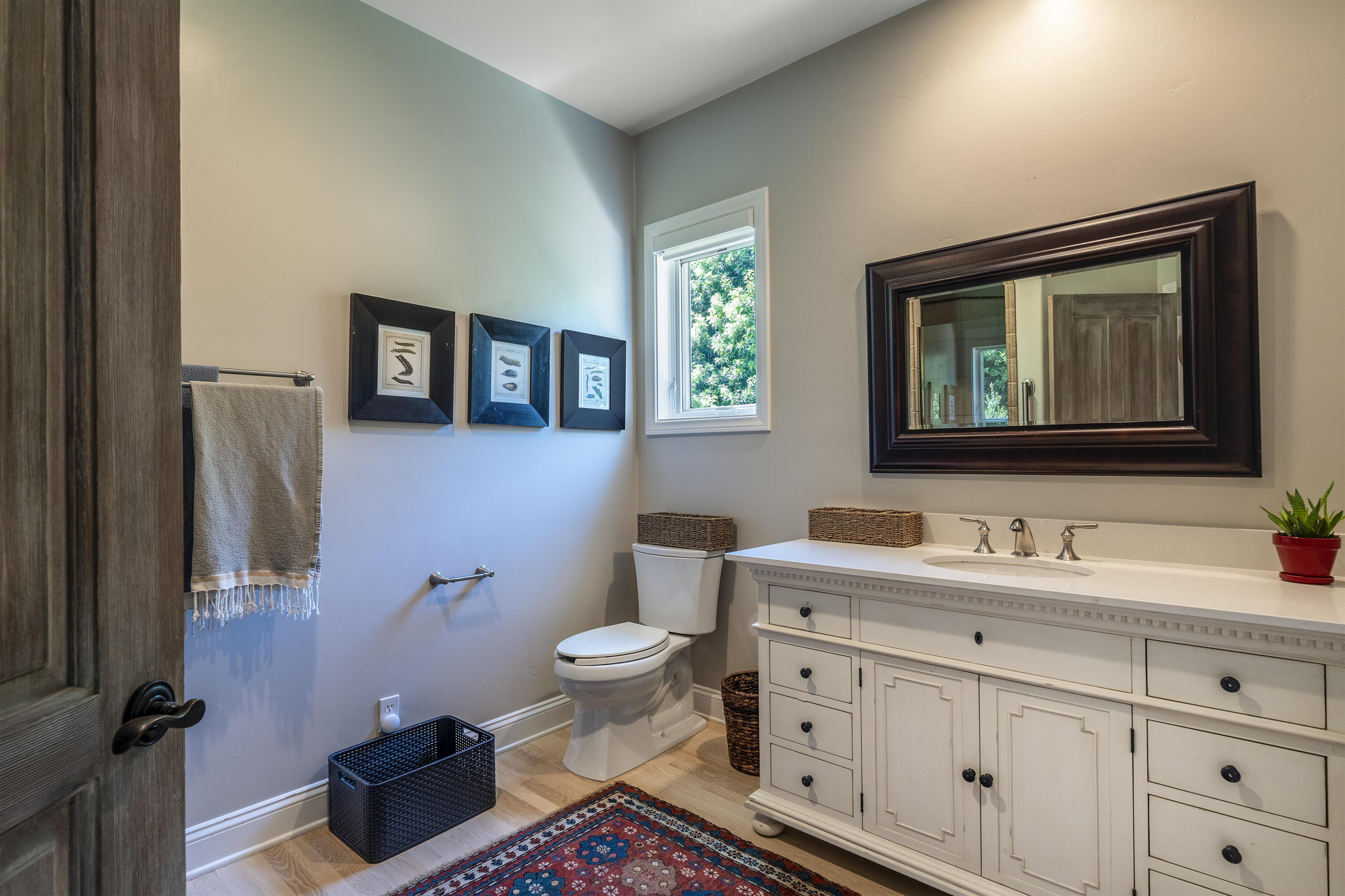 2850 Torito Road Santa Barbara, CA 93108 - Photo 15 of 18 a bathroom with a toilet sink and mirror