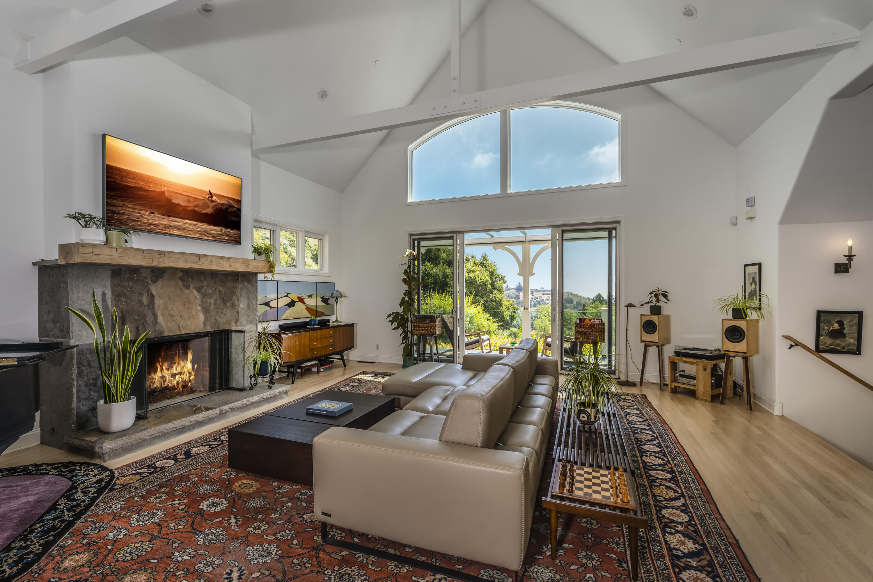 2850 Torito Road Santa Barbara, CA 93108 - Photo 2 of 18 a living room with furniture a flat screen tv and a fireplace