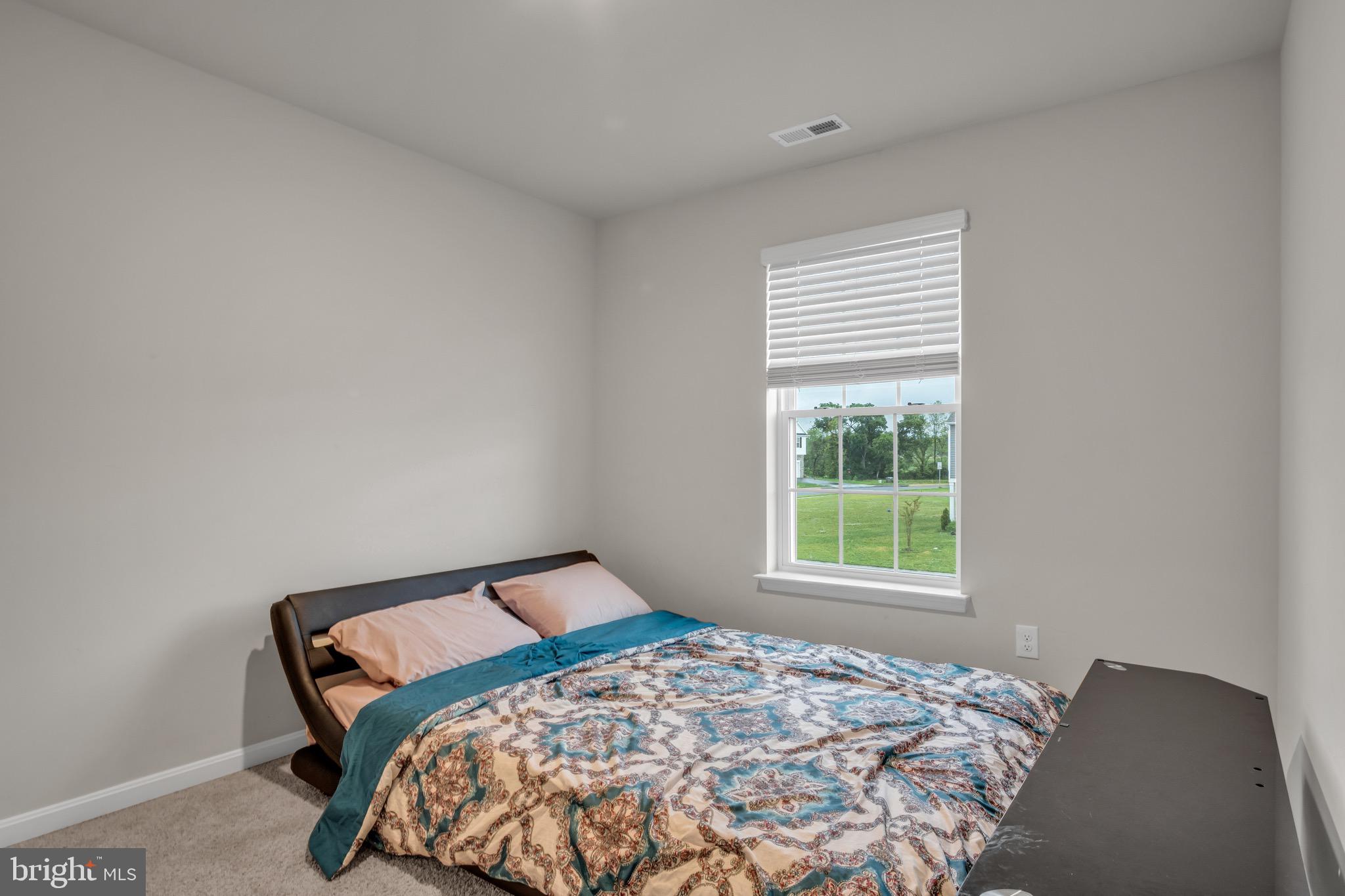 18 Smokehouse Road Carlisle, PA 17013 - Photo 25 of 33 a bedroom with a bed and a window