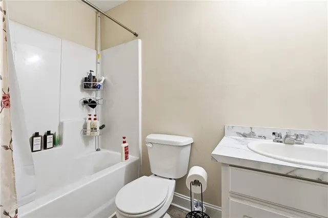 a bathroom with a sink a toilet and a bathtub