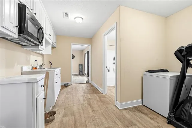 a view of a kitchen with a sink