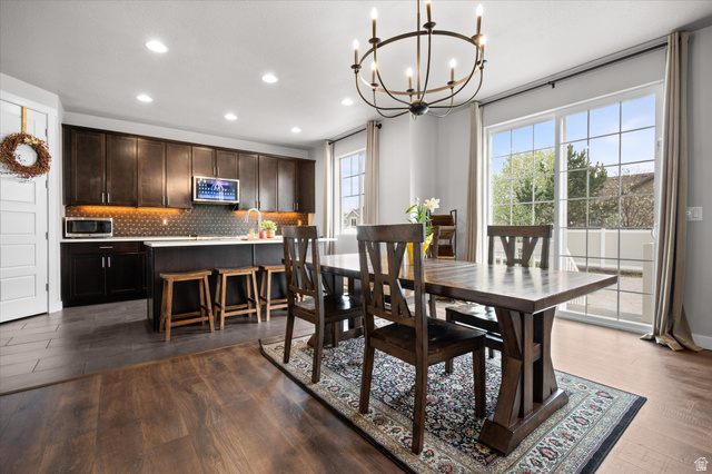 3359 Eurasian Crane Road Clinton, UT 84015 - Photo 10 of 71 Dining space with dark wood-type flooring and hanging lights
