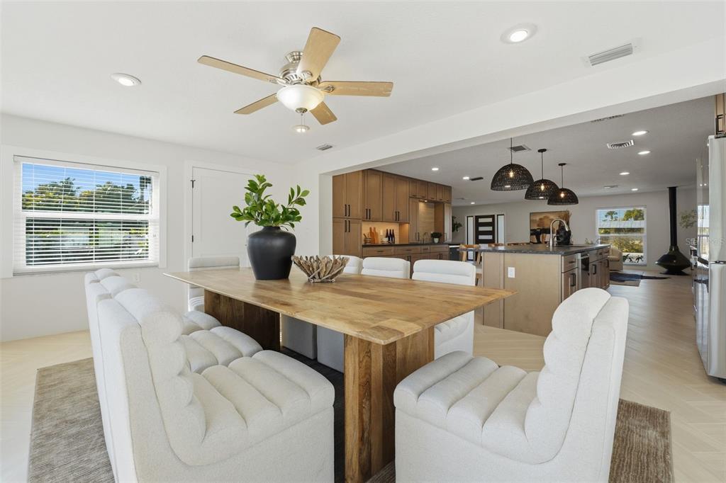 501 65th Street Holmes Beach, FL 34217 - Photo 28 of 61 a living room with furniture and kitchen view