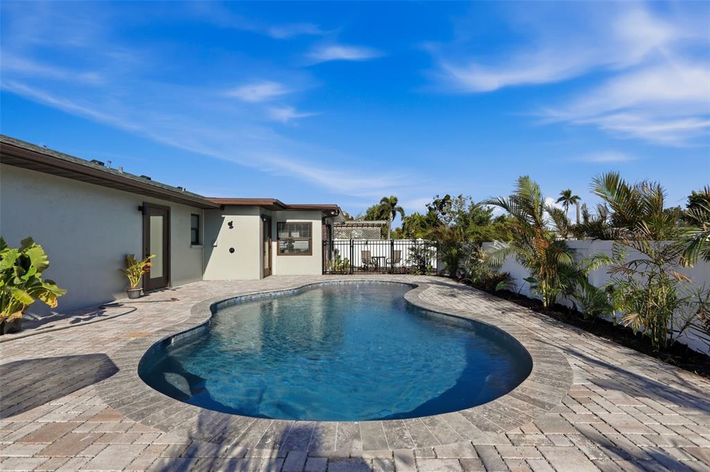 501 65th Street Holmes Beach, FL 34217 - Photo 3 of 61 a view of a house with swimming pool
