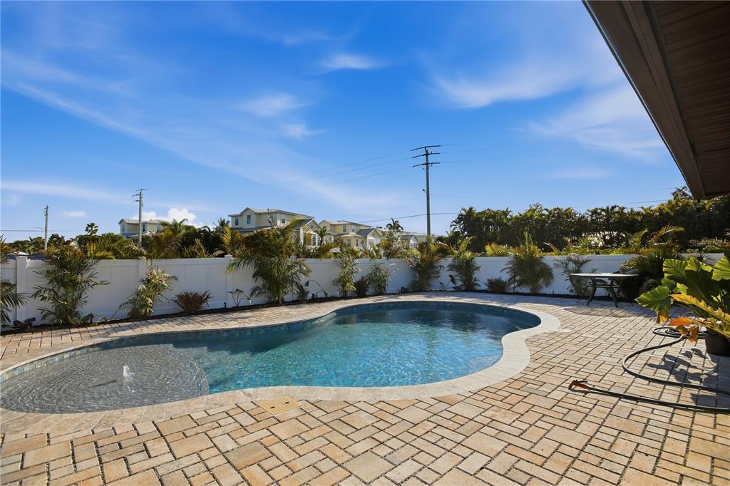 501 65th Street Holmes Beach, FL 34217 - Photo 50 of 61 a view of a swimming pool with a yard