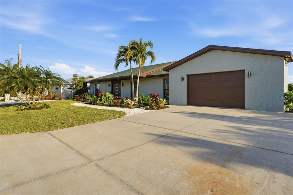 501 65th Street Holmes Beach, FL 34217 - Photo 5 of 61 a front view of a house with a yard