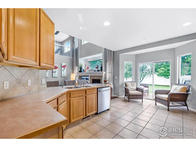 a kitchen with stainless steel appliances granite countertop a sink and cabinets