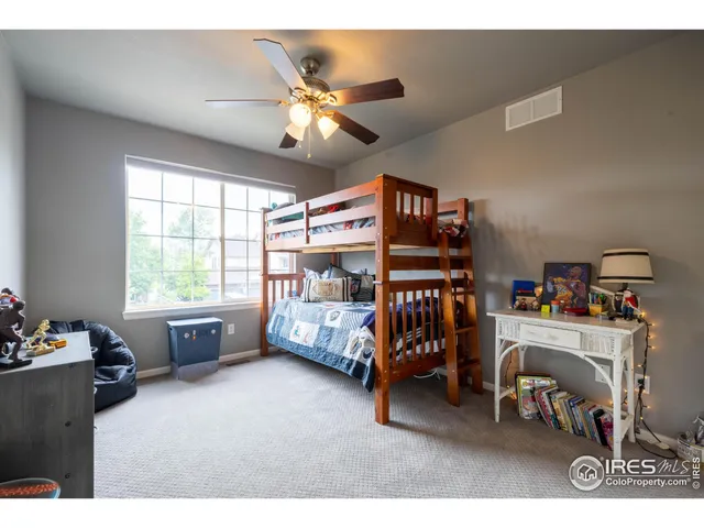 a bedroom with furniture and a window