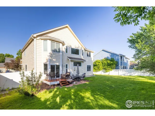 a view of a house with a yard porch and sitting area