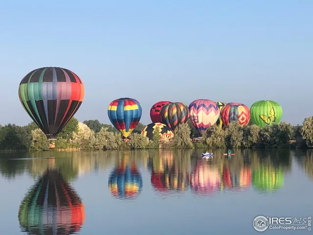 swimming pool view with boat and tables