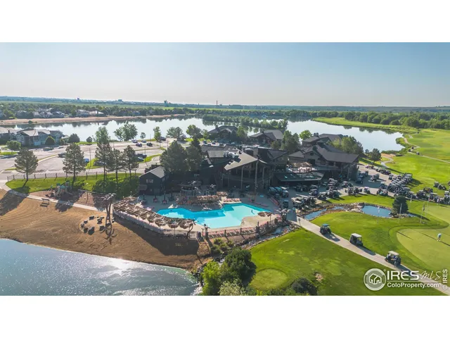 an aerial view of a house with a lake view