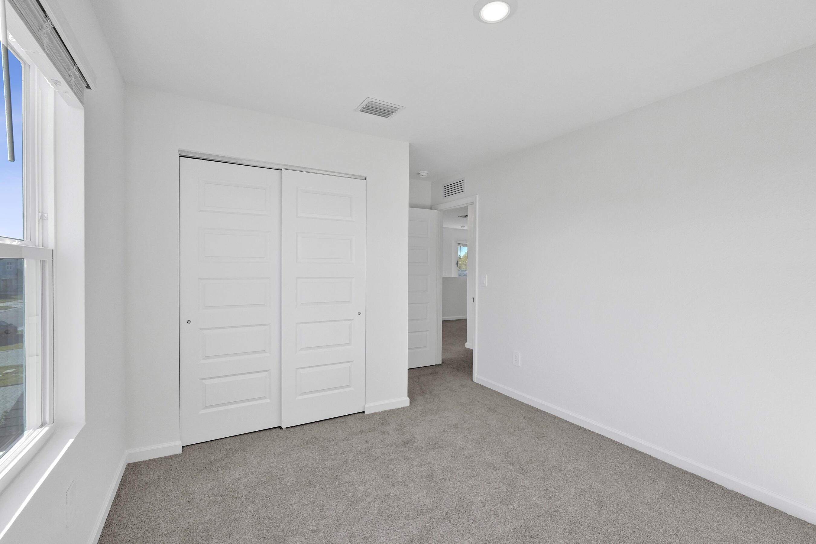 14308 Southwest New Dawn Road Indiantown, FL 34956 - Photo 14 of 25 a view of an empty room