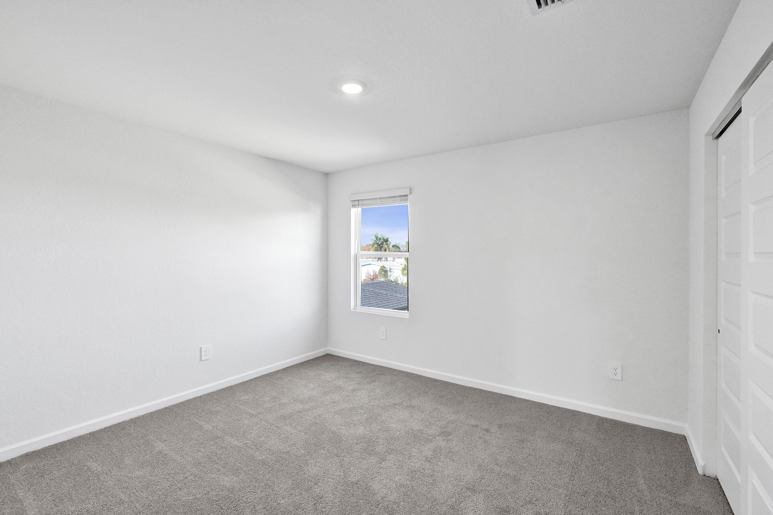 14308 Southwest New Dawn Road Indiantown, FL 34956 - Photo 15 of 25 a view of an empty room with a window