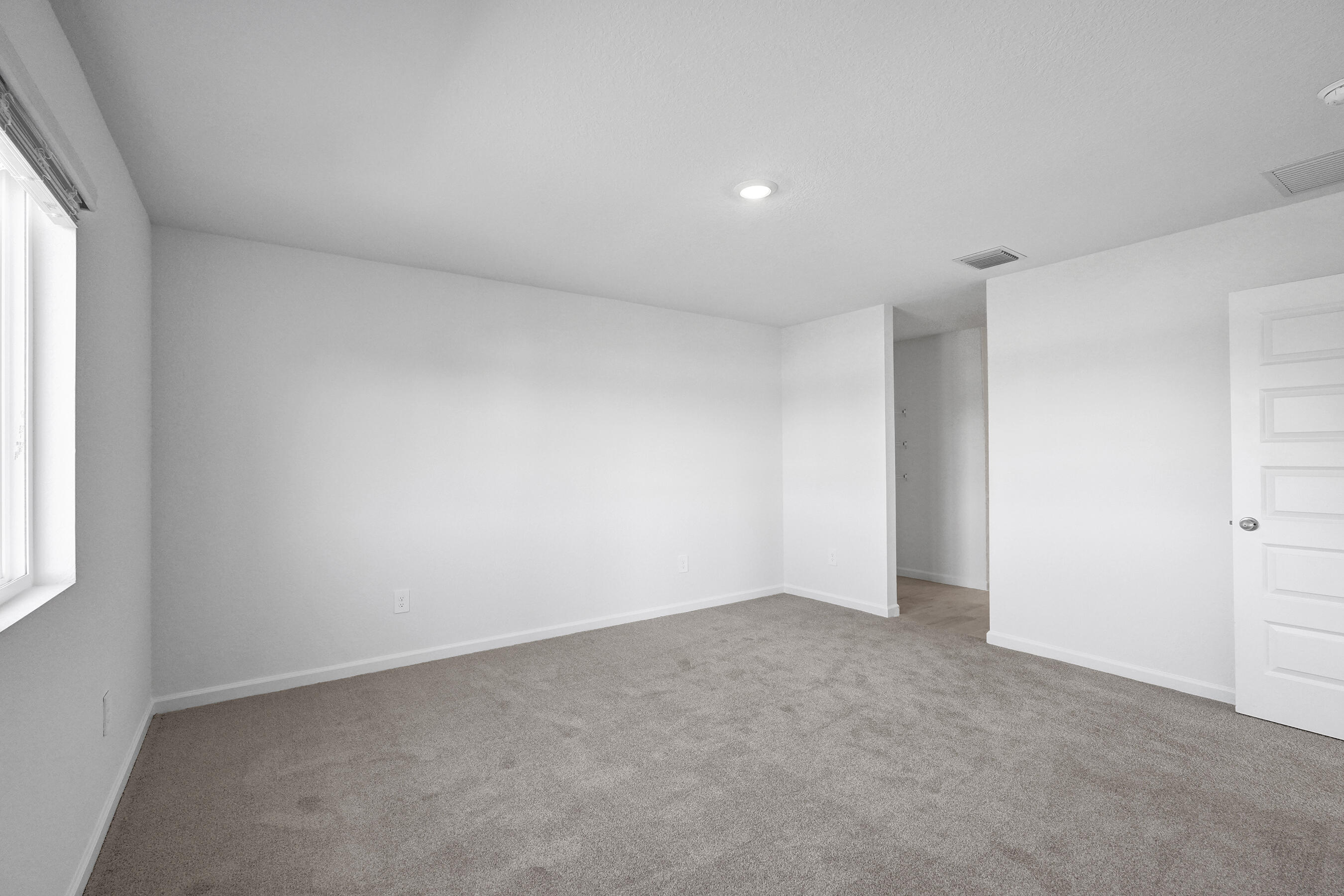 14308 Southwest New Dawn Road Indiantown, FL 34956 - Photo 17 of 25 an empty room with a window