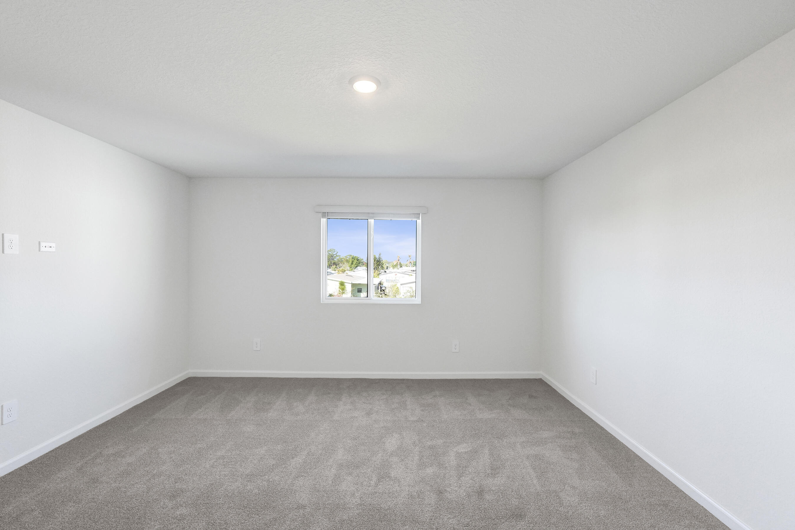 14308 Southwest New Dawn Road Indiantown, FL 34956 - Photo 19 of 25 an empty room with a window