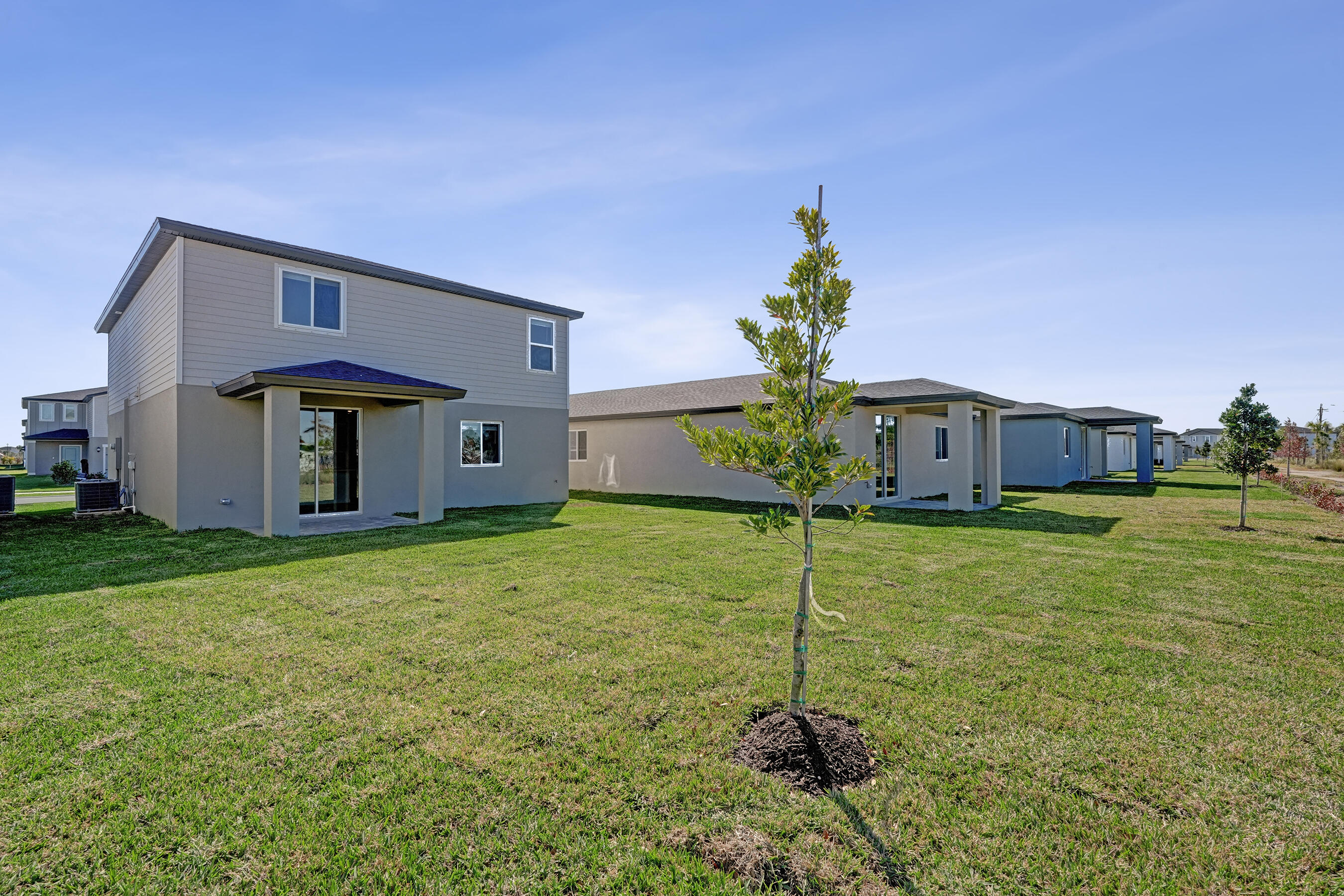 14308 Southwest New Dawn Road Indiantown, FL 34956 - Photo 21 of 25 a house view with a garden space