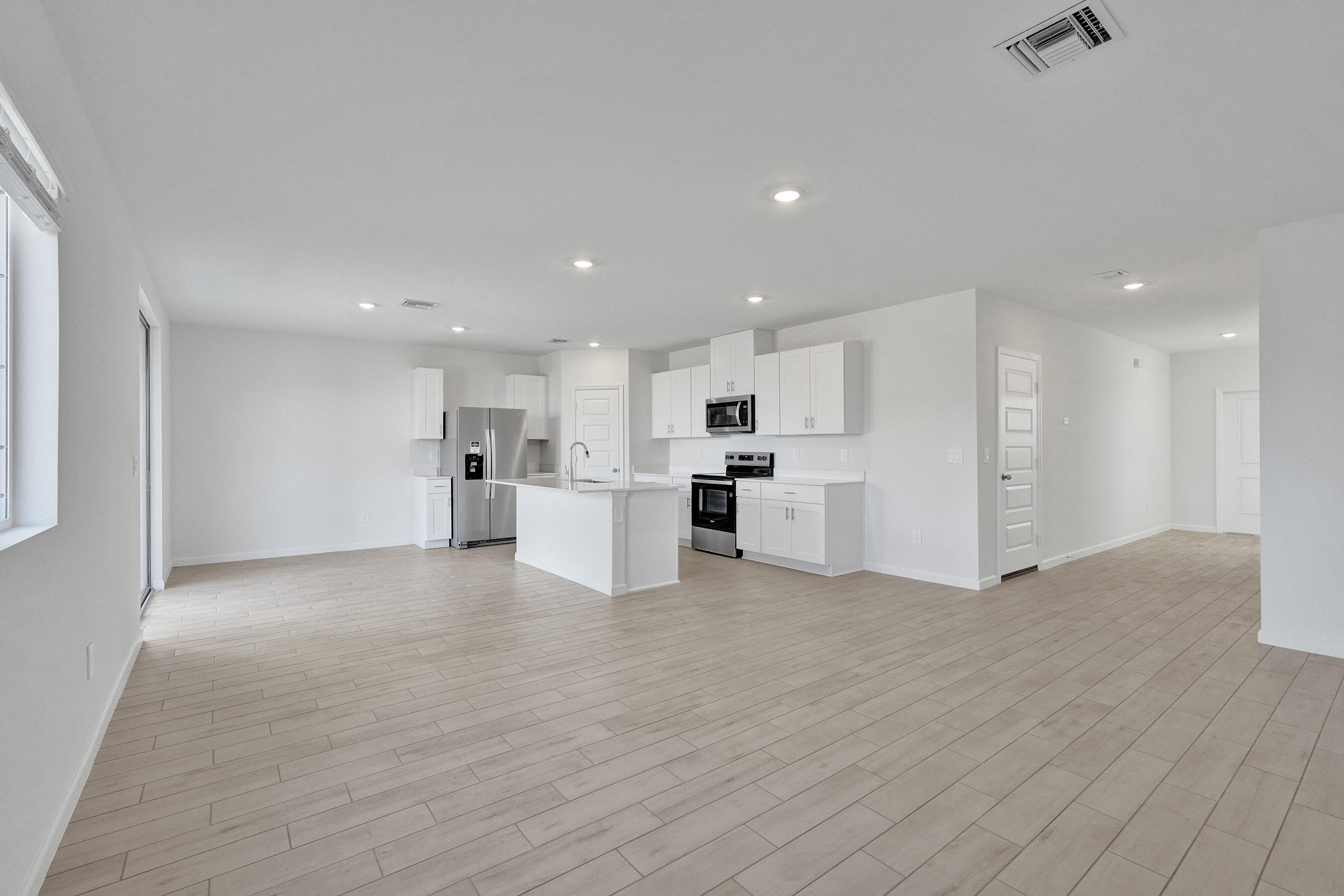 14308 Southwest New Dawn Road Indiantown, FL 34956 - Photo 5 of 25 a view of kitchen with wooden floor
