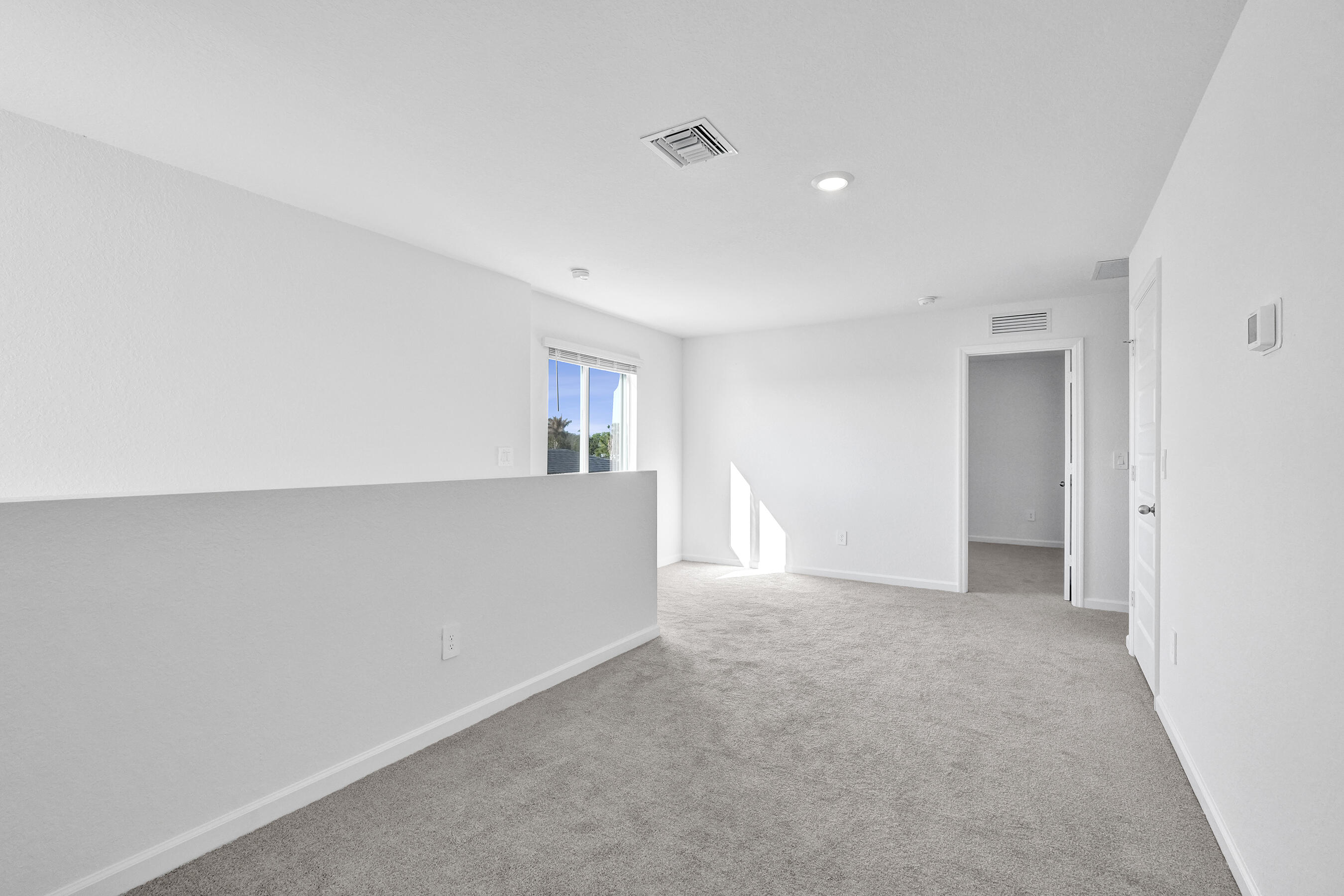 14308 Southwest New Dawn Road Indiantown, FL 34956 - Photo 7 of 25 a view of an empty room with window