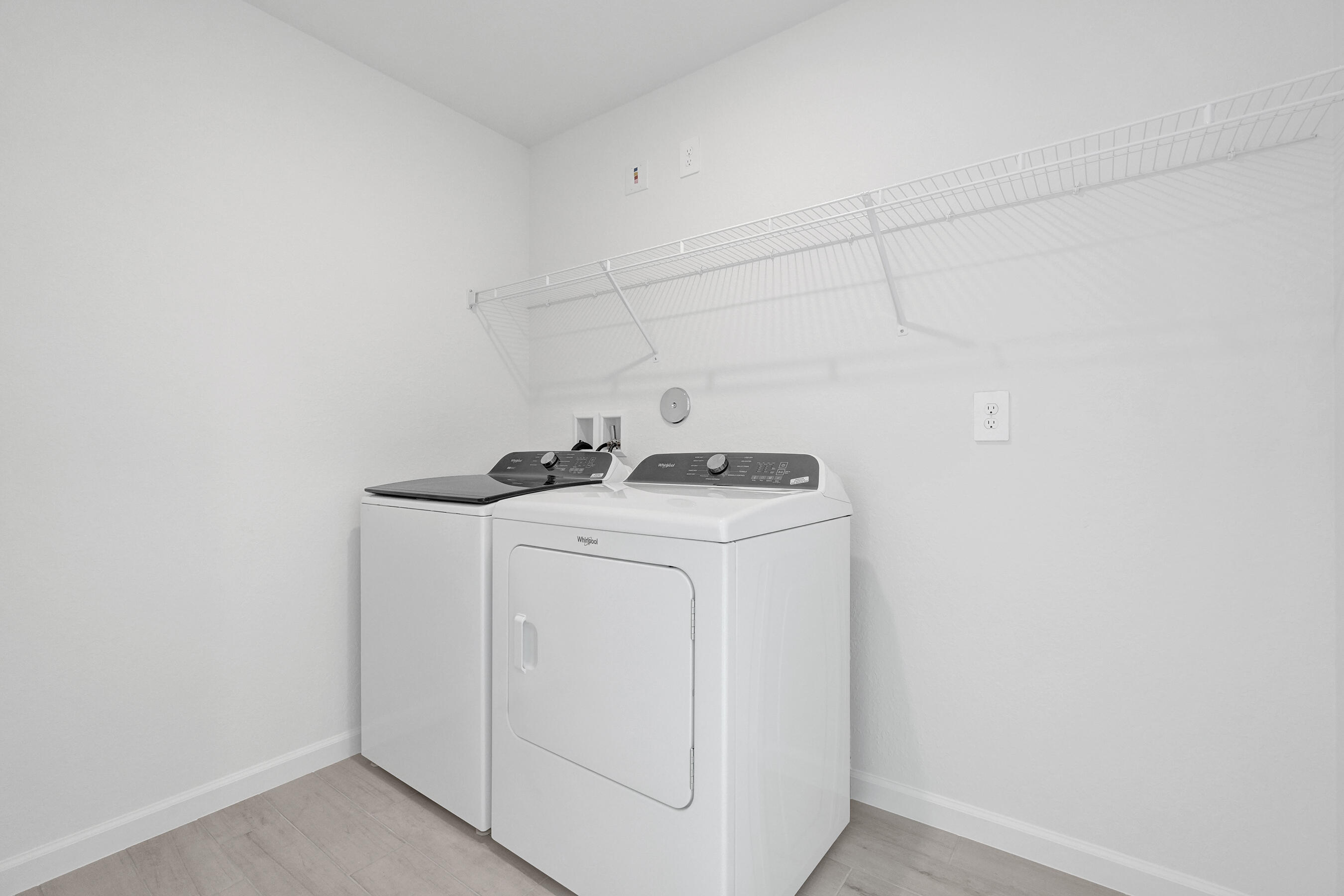 14308 Southwest New Dawn Road Indiantown, FL 34956 - Photo 9 of 25 a utility room with dryer and washer