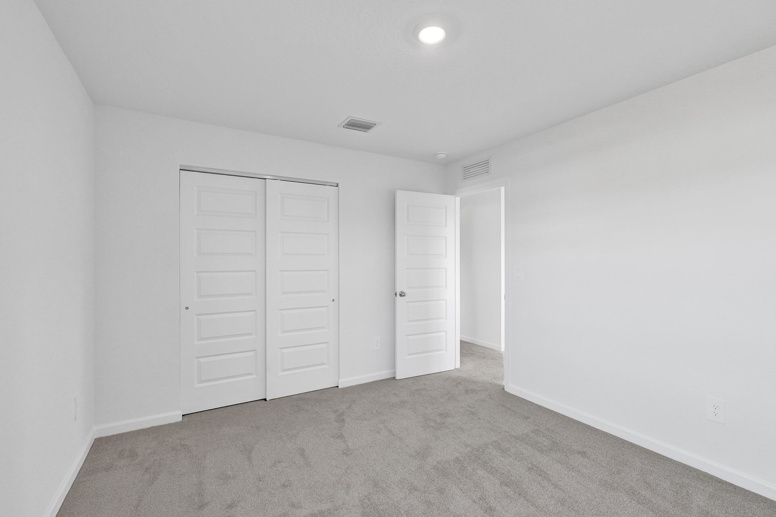 14308 Southwest New Dawn Road Indiantown, FL 34956 - Photo 10 of 25 a view of an empty room