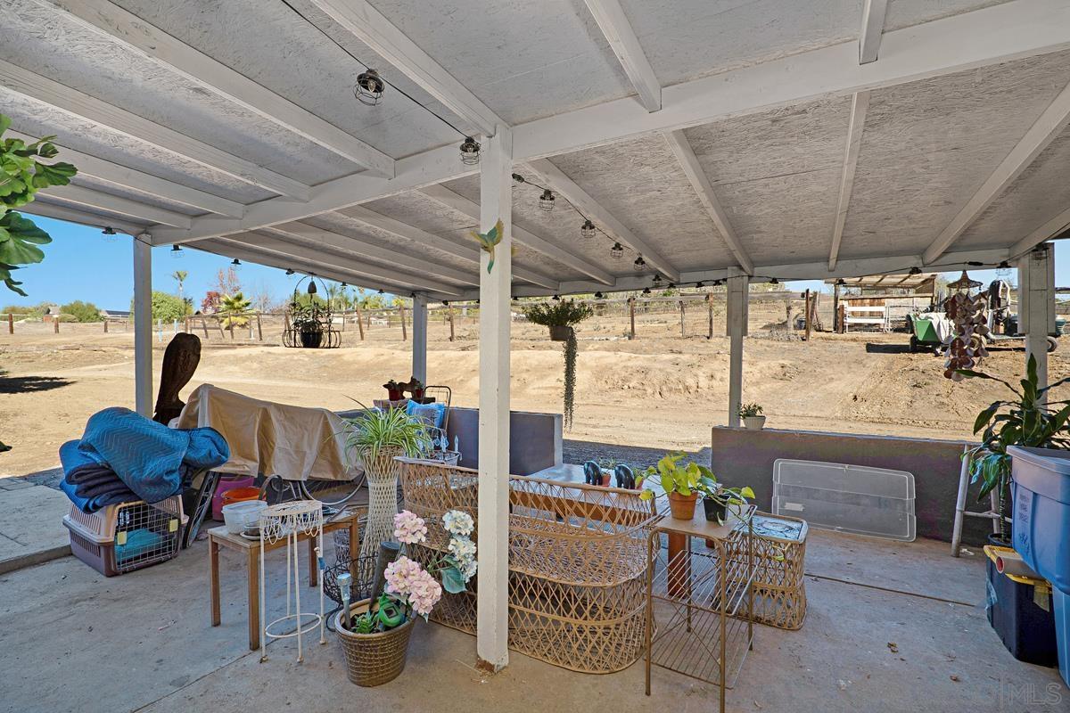 2756 Mission Road Fallbrook, CA 92028 - Photo 12 of 39 a room with lots of furniture and a chandelier