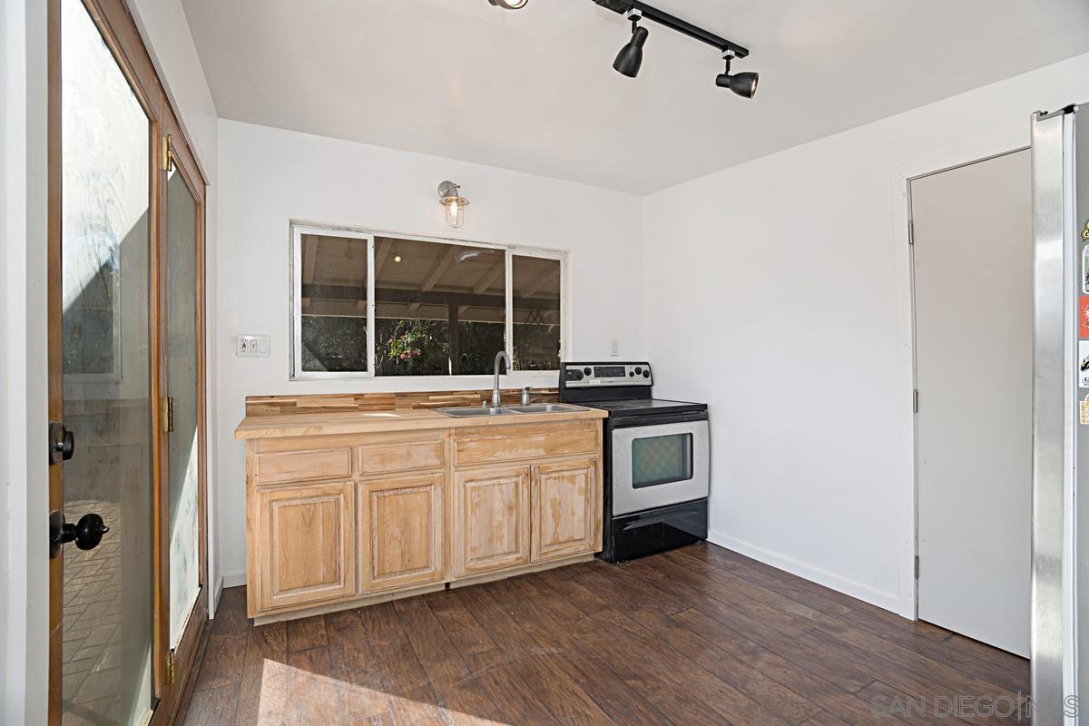 2756 Mission Road Fallbrook, CA 92028 - Photo 14 of 39 a kitchen with stainless steel appliances a stove and a refrigerator