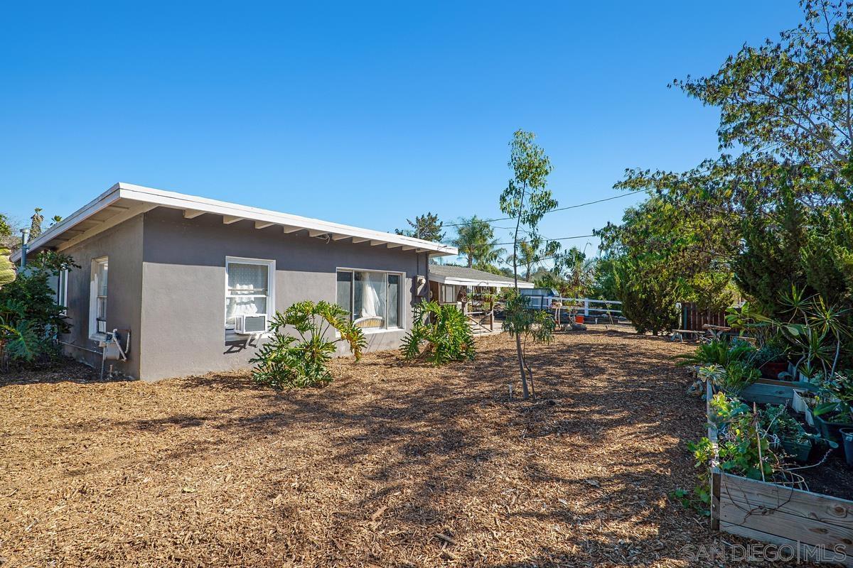 2756 Mission Road Fallbrook, CA 92028 - Photo 23 of 39 a view of a house with backyard and sitting area
