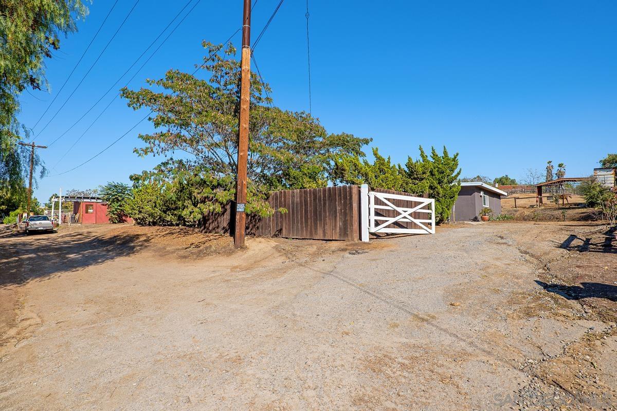 2756 Mission Road Fallbrook, CA 92028 - Photo 30 of 39 a row of palm trees and a fire pit