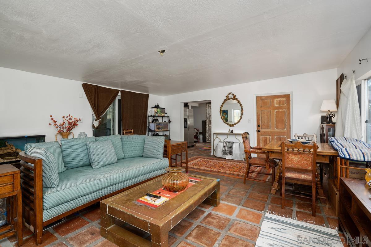 2756 Mission Road Fallbrook, CA 92028 - Photo 7 of 39 a living room with furniture a rug and a table