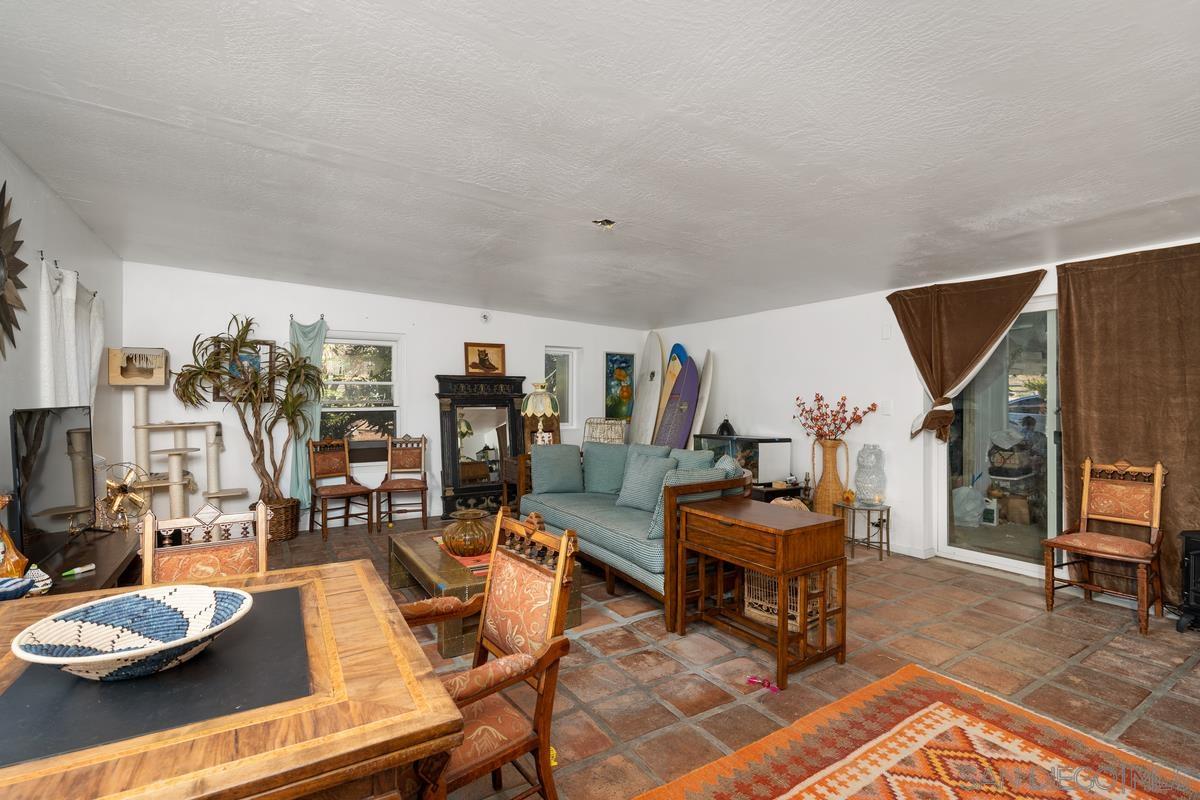 2756 Mission Road Fallbrook, CA 92028 - Photo 8 of 39 a living room with furniture and a flat screen tv