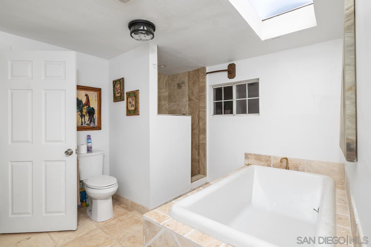 2756 Mission Road Fallbrook, CA 92028 - Photo 10 of 39 a bathroom with a tub and toilet