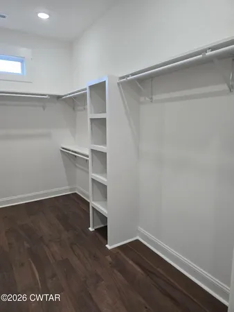 a view of an empty walk in closet