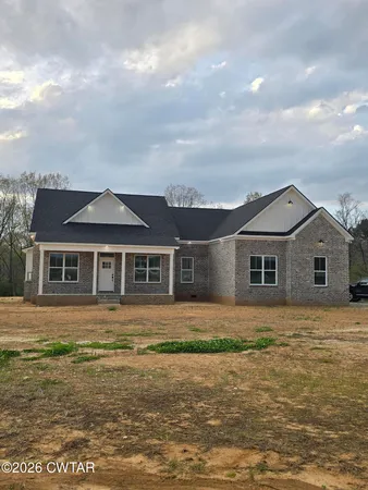 a front view of a house with yard