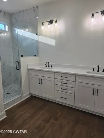 a view of a double vanity sink and mirror