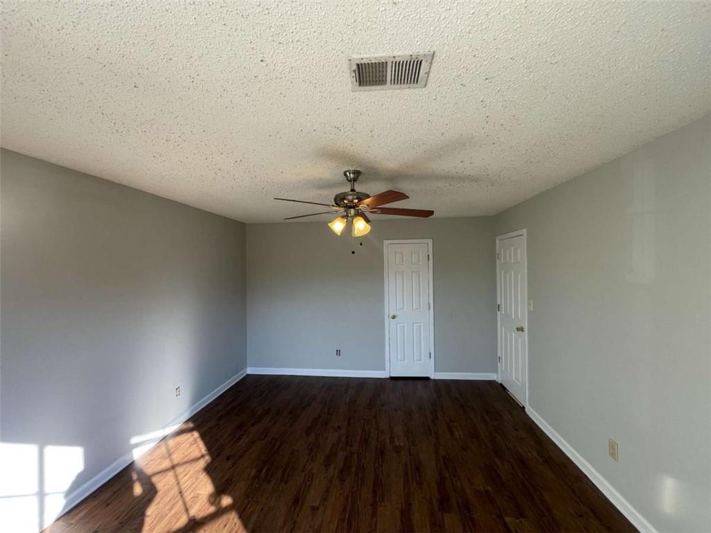 6387 Seths Way Lithonia, GA 30058 - Photo 18 of 44 a view of empty room with wooden floor
