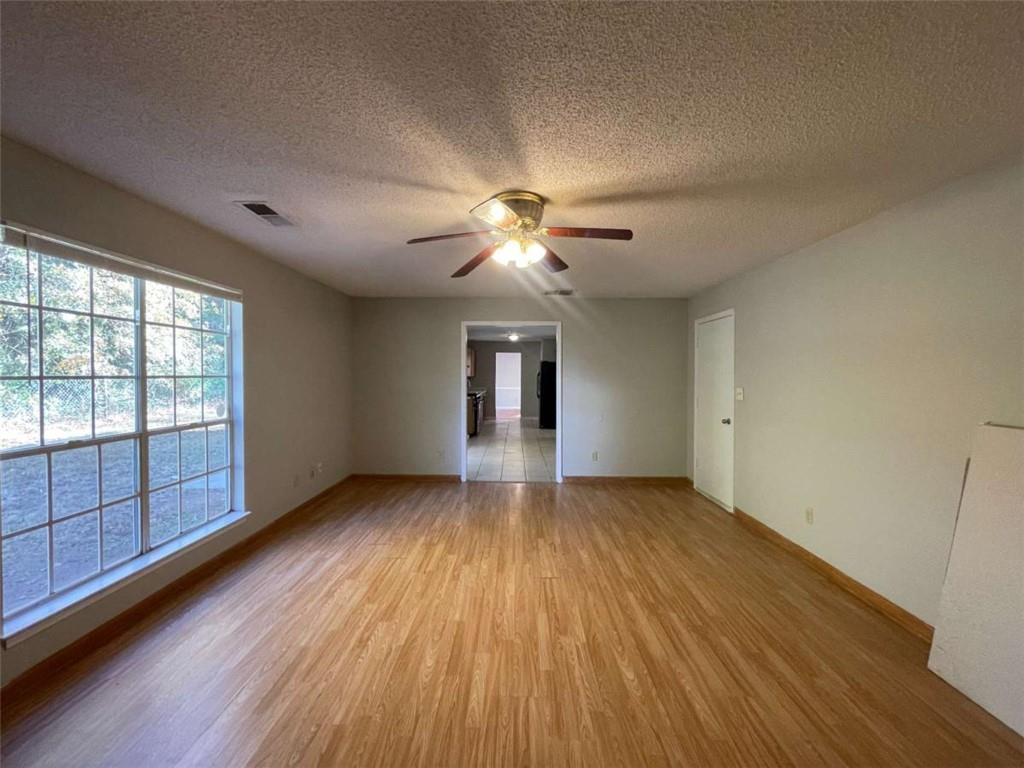 6387 Seths Way Lithonia, GA 30058 - Photo 20 of 44 wooden floor in an empty room with a window